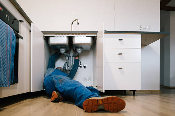 Professional Emergency Plumber technician working in Booneville, AR